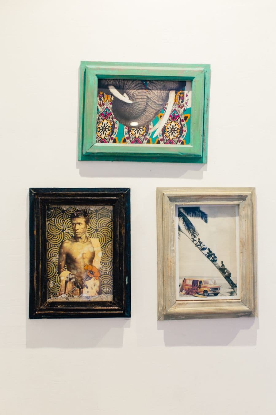Custom framed art on a white wall
