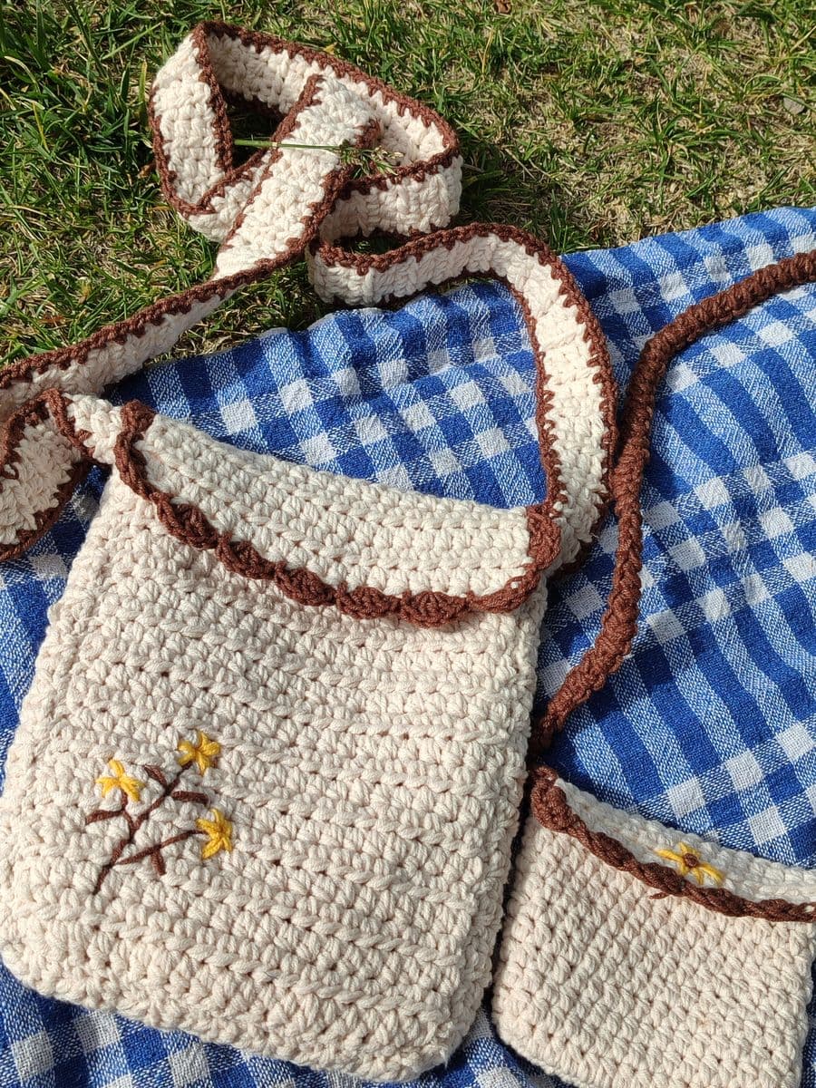 Handmade crochet bag with embroidered flowers